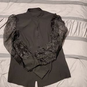 Black button down blouse with sheer puff sleeves